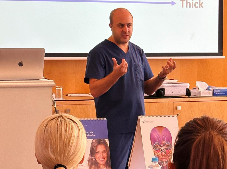 Cosmetic doctore speaking during a presentation